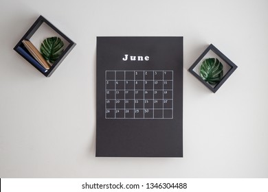 Black Calendar Hanging On Light Wall