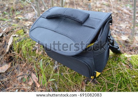 Black camera bag , zipper , standing on the ground Foto d'archivio © 