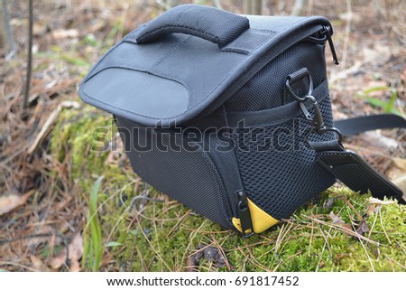 Black camera bag , zipper , standing on the ground Foto d'archivio © 
