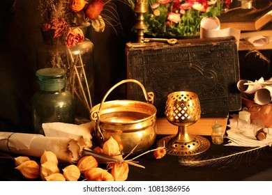 Black Candle Magic Ritual. Antique Magic Book. Witchcraft Peacock Feathers And Candle Background. Black Magic Love Spell, Book Of Shadows  And Rituals, Occultism, Witchcraft, Santería, And Pact.