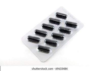 black capsule medicine in package