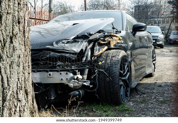 black car. crash accident on street, damaged\
automobiles after\
collision