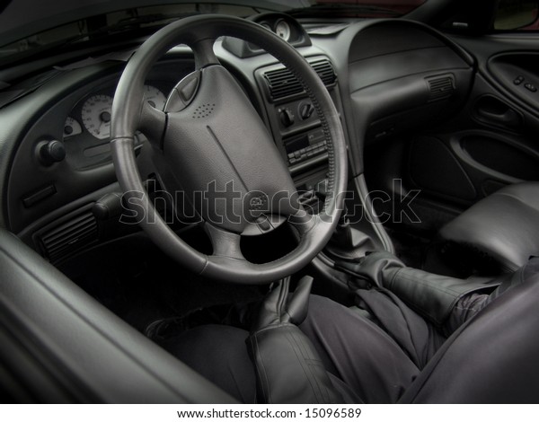 Black car interior with\
driver