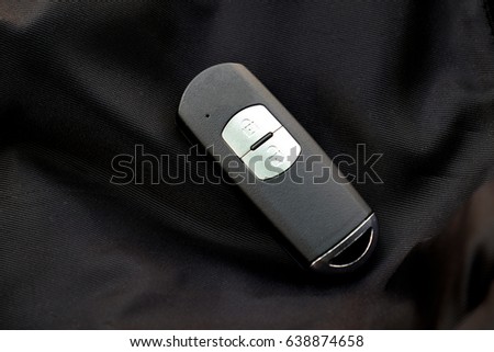 black car key on the black background