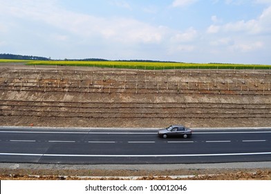 Black car on the straight horizontal road