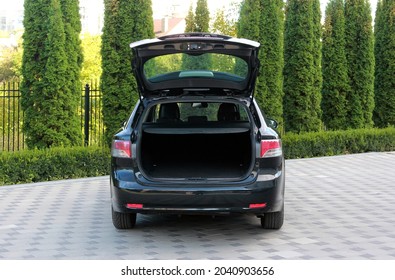 Black Car with an open trunk. Open trunk. 