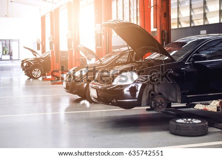 black car repair station with soft-focus in the background and over light