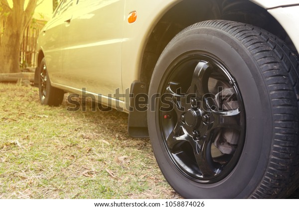 Black car wheel in\
retro style background