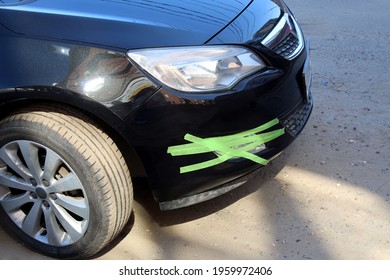 Black Car Wrapped In Green Duct Tape