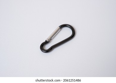 Black carabiner isolated on white background