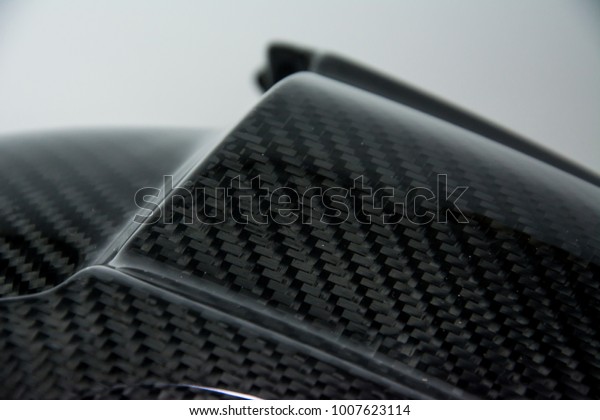 Black carbon\
fiber composite product close up\
view