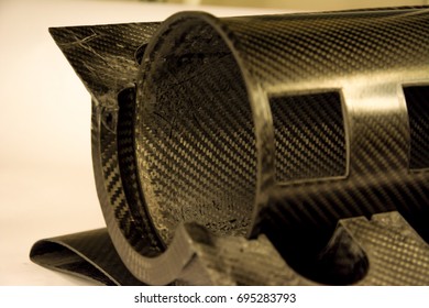 Black Carbon Fiber Composite Raw Material Close Up Background