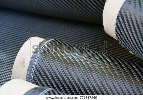 Black carbon fiber composite raw material in
the roll background