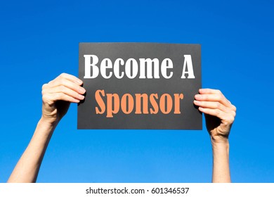 Black card placard with the concept of Become A Sponsor against a clear blue sky background