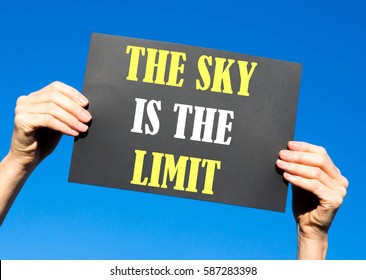 Black card placard with the concept of The Sky Is The Limit against a clear blue sky background - Shutterstock ID 587283398