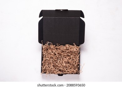 Black Cardboard Box On Wooden Office Desk