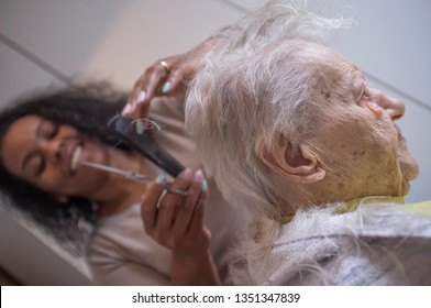 Black Caregiver Girl Cuts Hair To Elderly Caucasian Woman