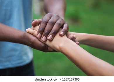 Black Caregiver Supporting Woman, Holding Her Hand Outdoors. Philanthropy, Kindness, Volunteering Concept, Copy Space