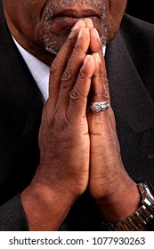 black Caribbean man praying in church stock image and stock photo