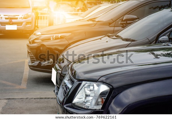 Black cars parked in car\
park,Car parked on street,Car parked on road,Cars parked row on\
road