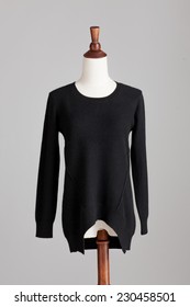 Black Cashmere Sweater With Wood Model On Grey Isolated