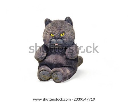 Black cat doll with yellow eyes isolated on white