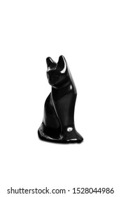 Black cat statue on isolated background
