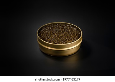 Black Caviar In The Gold Jar On The Black Background. Luxury Life