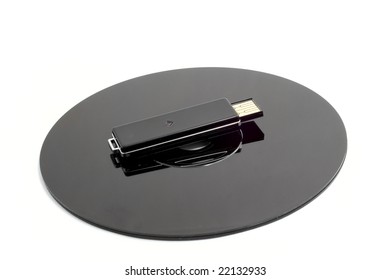 Black CD  compact disc and black removable USB drive isolated