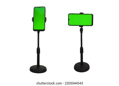 black cellphone tripod mount. with a green screen phone. isolated white background