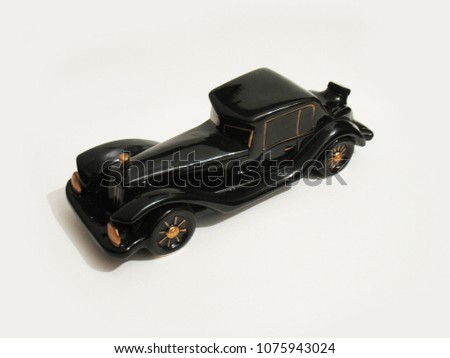 Black ceramic decanter in the form of a retro car.