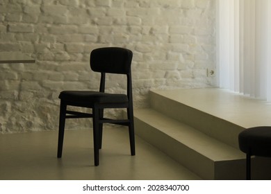 Black Chair In A All White Room. 