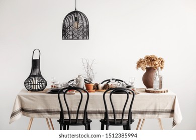 Black Chairs, Lantern And Lamp In Vintage Dining Room