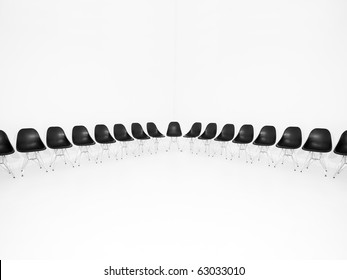 Black Chairs In A Row Isolated On White Background