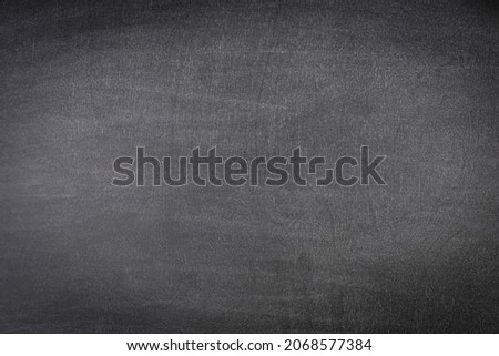 Black chalk board background with texture and copy space.