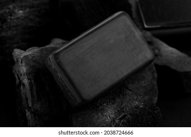 Black Charcoal Soap Bar On Black Coal Background