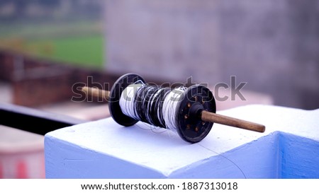 Black Charkhi with White Thread 

