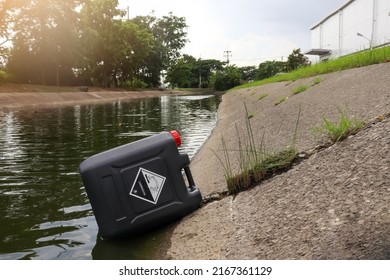 Black Chemical Tank In Industrial Canal