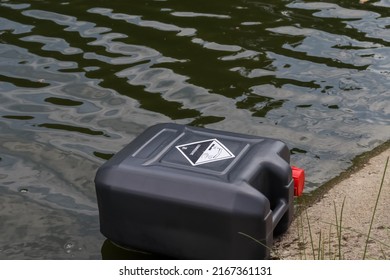 Black Chemical Tank In Industrial Canal