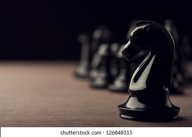 Black Chess Knight On Background