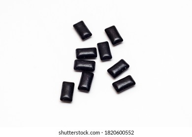 Black Chewing Gum On A White Background