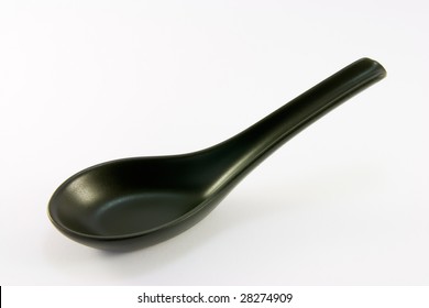 Black chinese china soup spoon on a white background - Powered by Shutterstock