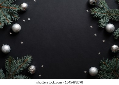 Black Christmas Banner Mockup With Fir Tree Branches, Silver Balls, Confetti. Christmas Frame, Greeting Card Template, Web Banner Mockup. Flat Lay, Top View, Copy Space