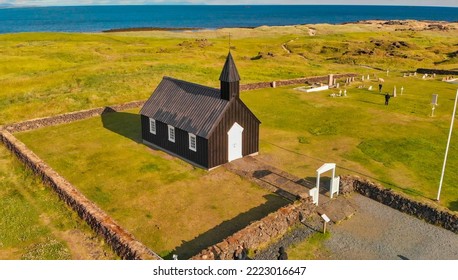 The Black Church Of Budir, Iceland. Aerial View At Sunset From Drone.