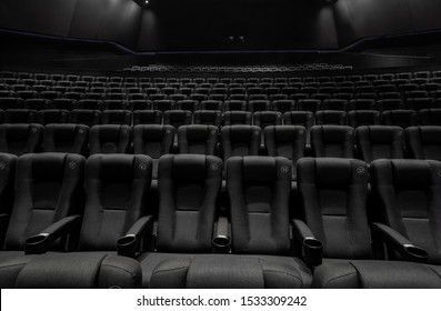 Black Cinema White Wide Screen And Auditorium Seats
