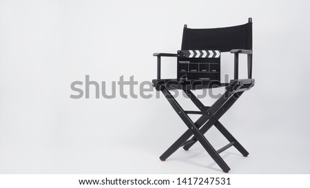 Black Clapper board or movie slate with director chair use in video production or movie and cinema industry. It's put on white background.
.
