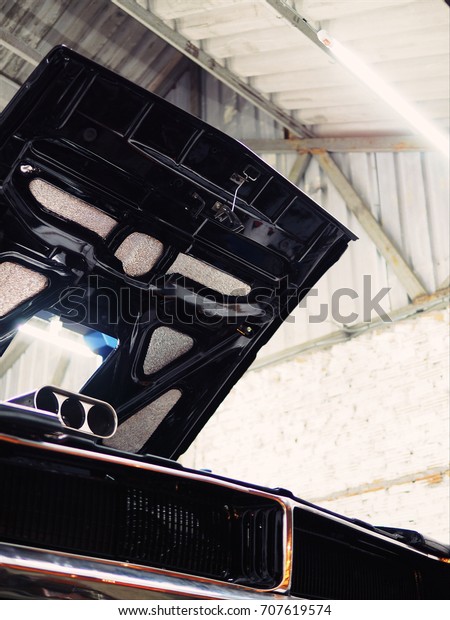 Black\
Classic American Muscle car in garage,Cars Auto Tuning Custom\
Muscle Retro Classic vintage,with copy\
space.