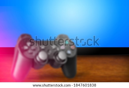 Black classic Playstation game controller on the desk