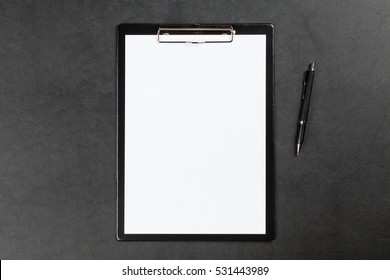 Black Clipboard On A Table