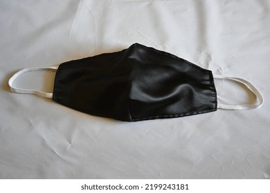 Black Cloth Mask On Isolated White Background